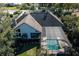 Aerial view of the home, highlighting the pool and screened-in lanai at 7705 Weeping Willow Cir, Sarasota, FL 34241