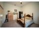 Spacious bedroom features carpet, wood furniture, and ceiling fan at 7705 Weeping Willow Cir, Sarasota, FL 34241