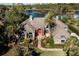 Beautiful waterfront home with meticulous landscaping and an inviting entrance and pathway at 7705 Weeping Willow Cir, Sarasota, FL 34241