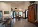 Bright kitchen featuring a circular breakfast table with bar seating, natural light, and tiled floors that add to its charm at 7705 Weeping Willow Cir, Sarasota, FL 34241
