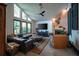 Inviting living room featuring vaulted ceilings, a modern fireplace, and comfortable seating that creates a cozy and stylish space at 7705 Weeping Willow Cir, Sarasota, FL 34241