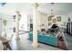 Spacious living room with columns, stone fireplace, and grand piano at 7705 Weeping Willow Cir, Sarasota, FL 34241