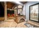 Covered patio featuring an outdoor kitchen and bar seating at 7705 Weeping Willow Cir, Sarasota, FL 34241