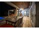 Inviting covered patio with dining area and outdoor kitchen at 7705 Weeping Willow Cir, Sarasota, FL 34241