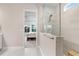 Modern bathroom with a glass-enclosed shower and open access to the main bedroom at 31534 Westbury Estates Ave, Wesley Chapel, FL 33545