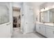 Bathroom with a glass walk-in shower, and direct access to a large walk-in closet at 31534 Westbury Estates Ave, Wesley Chapel, FL 33545