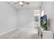 Bright bedroom with a ceiling fan and access to a full bathroom at 31534 Westbury Estates Ave, Wesley Chapel, FL 33545