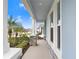 Inviting front porch with stone accents and a view of the neighborhood at 31534 Westbury Estates Ave, Wesley Chapel, FL 33545