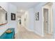 Hallway with custom art and decor, leading to bedrooms and living spaces at 31534 Westbury Estates Ave, Wesley Chapel, FL 33545