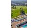 An aerial view shows a beautiful golf course and pool at 12209 Putter Green Ct, New Port Richey, FL 34654