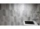 Close-up of the elegant marble tile backsplash at 12209 Putter Green Ct, New Port Richey, FL 34654