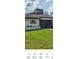Summertree Golf Club Entrance with green lawn at 12209 Putter Green Ct, New Port Richey, FL 34654