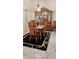 Formal dining room with a wooden table and traditional china cabinet at 12209 Putter Green Ct, New Port Richey, FL 34654
