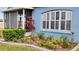 Charming home showcasing a well-manicured garden with lush greenery and an irrigation system to keep plants hydrated at 12209 Putter Green Ct, New Port Richey, FL 34654