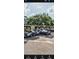 Several golf carts lined up on a paved area under a blue sky, ready for a leisurely day on the green at 12209 Putter Green Ct, New Port Richey, FL 34654