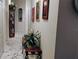 Hallway features marble floors, a built-in display case, and decorative art at 12209 Putter Green Ct, New Port Richey, FL 34654
