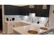 Stylish kitchen with modern appliances, attractive backsplash, and bar seating at 12209 Putter Green Ct, New Port Richey, FL 34654