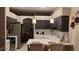 Well-lit kitchen featuring stainless steel appliances, white countertops, and pendant lighting at 12209 Putter Green Ct, New Port Richey, FL 34654