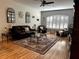 Spacious living room with high ceilings, plantation shutters, and elegant decor, creating a welcoming atmosphere at 12209 Putter Green Ct, New Port Richey, FL 34654