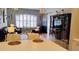Bright living room with a large window, hardwood floors, and neutral decor at 12209 Putter Green Ct, New Port Richey, FL 34654