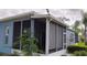 Relaxing screened-in patio offers a private outdoor living space with serene views at 12209 Putter Green Ct, New Port Richey, FL 34654
