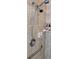 A modern shower showcasing a dual shower head with stylish fixtures and a convenient grab bar at 12209 Putter Green Ct, New Port Richey, FL 34654