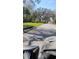 Street lined with mature trees creating a peaceful, shaded canopy at 12209 Putter Green Ct, New Port Richey, FL 34654