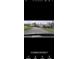 Street view of a complex with mature trees and well-maintained grounds at 12209 Putter Green Ct, New Port Richey, FL 34654