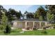Relax on the patio of this charming home, surrounded by lush landscaping and serene views at 15897 Melport Cir, Port Charlotte, FL 33981