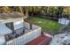 Aerial view of the backyard and fence with patio, lawn, and storage shed at 1766 12Th N Ave, St Petersburg, FL 33713