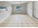 Bright living room with tile flooring and a window offers a welcoming space at 5606 N 32Nd St, Tampa, FL 33610