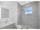 Updated bathroom showcasing a walk-in shower with glass door and modern vanity at 6741 64Th E Ter, Bradenton, FL 34203