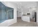 Open living room and kitchen layout featuring hardwood floors, recessed lighting, and white walls at 6741 64Th E Ter, Bradenton, FL 34203