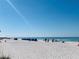 Scenic beach featuring white sand, clear water, and beach chairs at 19417 Gulf Blvd # B209, Indian Rocks Beach, FL 33785