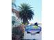 Barefoot Beach Resort sign surrounded by lush tropical landscaping at 19417 Gulf Blvd # B209, Indian Rocks Beach, FL 33785