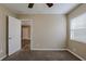 This is a clean bedroom featuring neutral tones and a window for natural light at 3408 Phillips St, Tampa, FL 33619