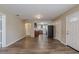 Open-concept living area featuring wood floors, neutral walls, and direct access to the kitchen at 3408 Phillips St, Tampa, FL 33619