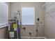A practical utility room equipped with a water heater at 3408 Phillips St, Tampa, FL 33619