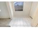 Dining area featuring tile flooring and a window at 5321 Baroque Dr, Holiday, FL 34690