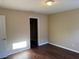 Bedroom with neutral paint, dark wood floor, closet, and natural light at 10509 Marsanne Pl, Riverview, FL 33578