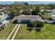 Spacious home with manicured lawn, long driveway and mature palms; backyard privacy fencing at 12339 138Th N St, Largo, FL 33774