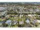 Aerial view of a quaint neighborhood dotted with mature trees and well-kept lawns at 12339 138Th N St, Largo, FL 33774