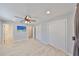 Large bedroom offering durable flooring, neutral paint, ceiling fan, and ensuite bath at 12339 138Th N St, Largo, FL 33774