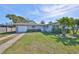 Charming single-story home boasts a well-manicured lawn, lush landscaping, and a welcoming facade at 12339 138Th N St, Largo, FL 33774