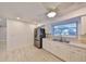 Bright kitchen features stainless steel refrigerator, double sink and durable flooring at 12339 138Th N St, Largo, FL 33774