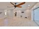 Open concept living room showcases neutral paint, durable floors, and ceiling fan at 12339 138Th N St, Largo, FL 33774