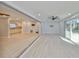 Open living room has durable flooring, neutral paint and seamless access to the kitchen at 12339 138Th N St, Largo, FL 33774