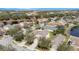 Scenic aerial view of a residential area featuring homes, landscaping, and a nearby lake at 15107 Searobbin Dr, Lakewood Ranch, FL 34202
