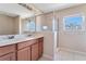 Bathroom with double sink vanity and glass shower at 15107 Searobbin Dr, Lakewood Ranch, FL 34202