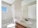 Bathroom with a white tub and a large mirror at 15107 Searobbin Dr, Lakewood Ranch, FL 34202